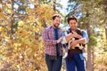 Gay Male Couple With Baby Walking Through Fall Woodland Royalty Free Stock Photo