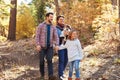 Gay Male Couple With Children Walking Through Fall Woodland Royalty Free Stock Photo