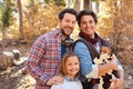 Gay Male Couple With Children Walking Through Fall Woodland Royalty Free Stock Photo