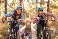 Gay Male Couple With Daughter Cycling Through Fall Woodland Royalty Free Stock Photo