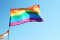 Gay man holding rainbow LGBT flag