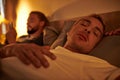 gay man sleeping near unfaithful boyfriend