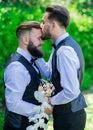 Gay man with partner on wedding day. Gay kiss on wedding. marriage gay couple tender kissing. close up portrait of gay Royalty Free Stock Photo