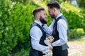 Gay man with partner on wedding day. Married LGBT couples celebrate a romantic wedding ceremony together with a bouquet Royalty Free Stock Photo