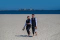 Gay men walking on a beach. Lgbt gay marriage couple having romantic moment together after wedding ceremony. Concept of Royalty Free Stock Photo