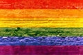 Gay flag painted on a brick wall, Rainbow background