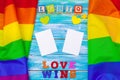 Gay pride flag on wooden table. Close up. Royalty Free Stock Photo