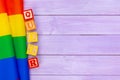 Gay pride flag on wooden table. Close up. Royalty Free Stock Photo