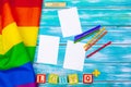 Gay pride flag on wooden table. Close up. Royalty Free Stock Photo