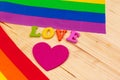 Gay pride flag on wooden table. creative photo. Royalty Free Stock Photo