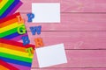 Gay pride flag on wooden table. Close up. Royalty Free Stock Photo