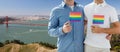 Men with gay pride flags over golden gate bridge Royalty Free Stock Photo