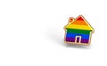 Gay Pride Rainbow In A Home Shape Isolated On White Background. Copy Space On The Left Side. LGBTQ People Rights To Live Together