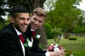 Gay weddings, grooms, couples pose for pictures after their wedding ceremony in churchyard Royalty Free Stock Photo