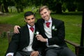 Gay weddings, grooms, couples pose for pictures after their wedding ceremony in churchyard Royalty Free Stock Photo