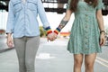 Gay women holding hands with rainbow bracelets Royalty Free Stock Photo