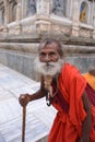 An anonymous Hindu holy man seeks alms at Mahabodhi temple, Bodh Gaya, India Royalty Free Stock Photo