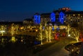 Gaylord Texan building in Christmas illumination. View from above. Reflection in the pond at twilight