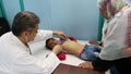 Gaza city, a young child attended to by a doctor in a hospital