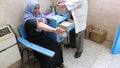 Gaza city, a young woman being attended to by a doctor in a hospital