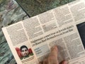 During the Gaza-Israel conflict, a male hand is seen reading the headline