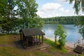 Gazebo for barbecues in the woods by the lake Royalty Free Stock Photo