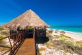 Gazebo and bridge on the sandy beach Playa Paradise of the island of Cayo Largo, Cuba. Copy space for text. Royalty Free Stock Photo