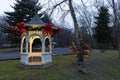 Gazebo and Christmas tree reflected on a lake Royalty Free Stock Photo