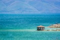 Gazebo by Coast of clear Sevan Lake in Armenian mountains, Armenia, Asia