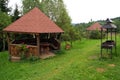 Gazebo in garden on cotage backyard. Green grass around Royalty Free Stock Photo