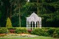 Gazebo in green spring summer garden