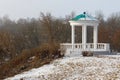 Gazebo in historical park, house of the nobility by a snowy day