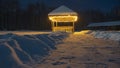 Gazebo, illuminated by lanterns, in the winter park. Royalty Free Stock Photo