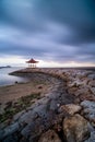 Gazebo at Karang beach, Sanur, Bali, Indonesia on background of the gloomy sky Royalty Free Stock Photo