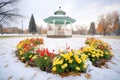 gazebo in park with frostbitten flowerbeds