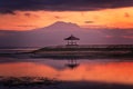 Gazebo at Sanur beach with Mount Agung volcano background, sunrise Royalty Free Stock Photo