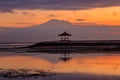 Gazebo at Sanur beach with Mount Agung volcano background, sunrise Royalty Free Stock Photo