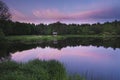 Gazebo on the shore of a forest lake at sunset, Royalty Free Stock Photo