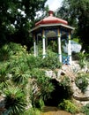 A gazebo stands on a rock in the park Royalty Free Stock Photo