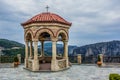 Gazebo stone European medieval building object in observation yard space with highland mountain background landscape in gray