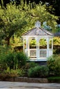 A white traditional style eight sided gazebo.