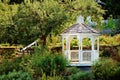 A white traditional style eight sided gazebo.