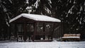Gazebo in the winter forest Royalty Free Stock Photo