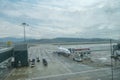 Airplane of Anadolu Jet Airlines waiting to fly in a rainy day on airdrome runway in Spring in Aydin Menders Airport