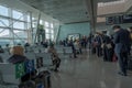 Passengers wait for their turn come to get in the plane in front of airplane gate in Aydin Menderes Airport