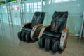 Gaziemir, Izmir, Turkey - 03.11.2021: two empty leather massage chairs in Aydin Menderes Airport for passengers