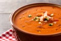 Gazpacho soup in crockpot on wooden table