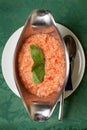 Gazpacho soup garnished with basil leaves