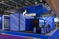 Gazprom's blue exhibition stand with the company logo and name. Stand with bright blue LED lighting. Moscow, Russia -