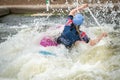 GB Canoe Slalom Athlete in C1W class in white water action. Paddling away and surrounded by splashes Royalty Free Stock Photo